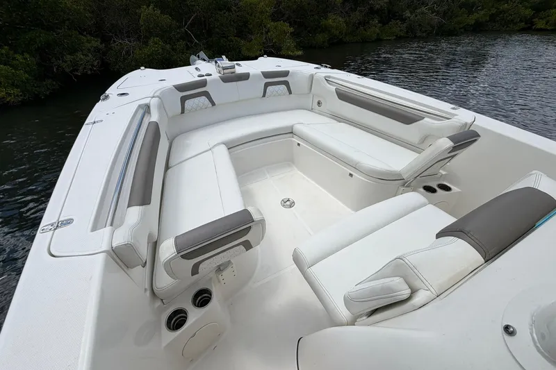Slide: The Image of 2020 World Cat 295 CC boat interior with spacious seating and cup holders. - 22