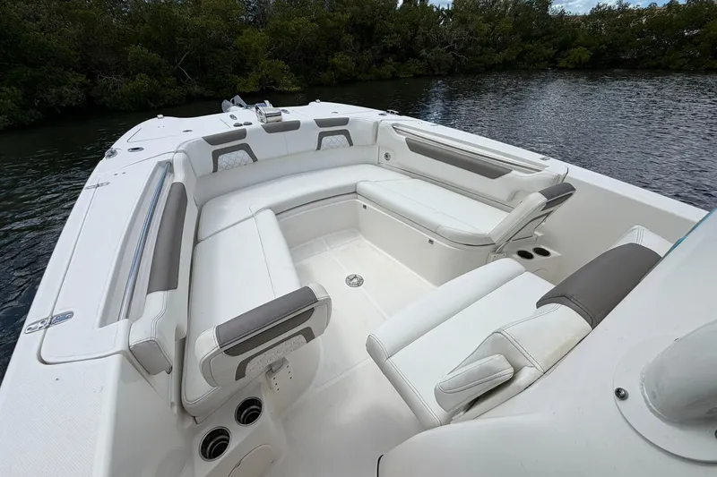 Slide: The Image of 2020 World Cat 295 CC boat interior with spacious seating and cup holders. - 23
