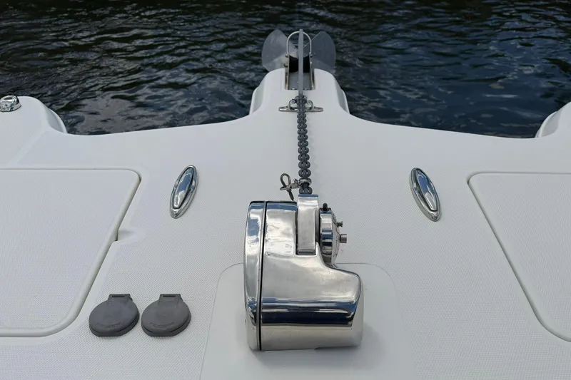 Slide: The Image of 2020 World Cat 295 CC boat anchor system on deck by water. - 25