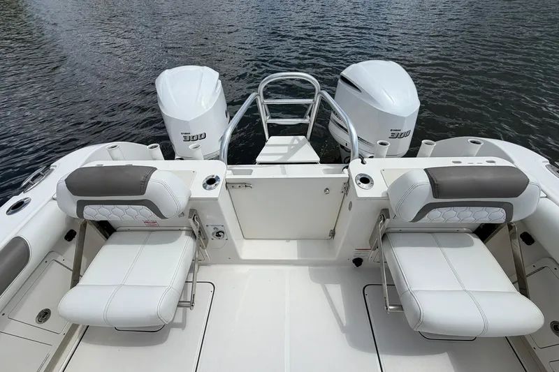Slide: The Image of 2020 World Cat 295 CC boat with dual Yamaha 300 engines and comfortable seating. - 8