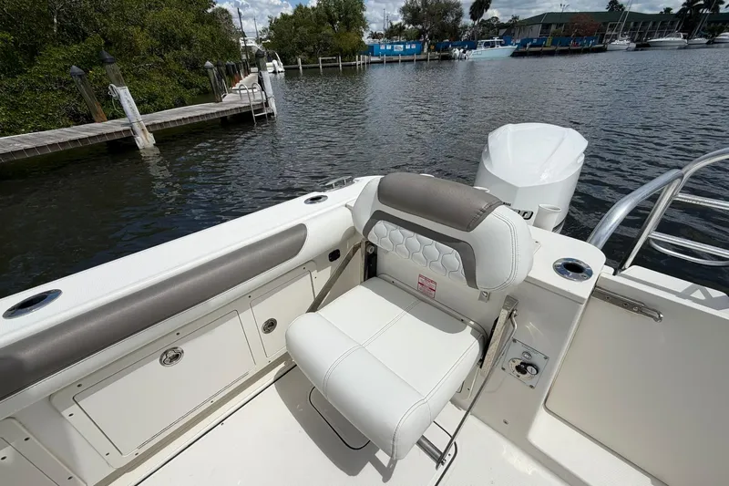 Slide: The Image of 2020 World Cat 295 CC boat interior with seating and water view. - 9