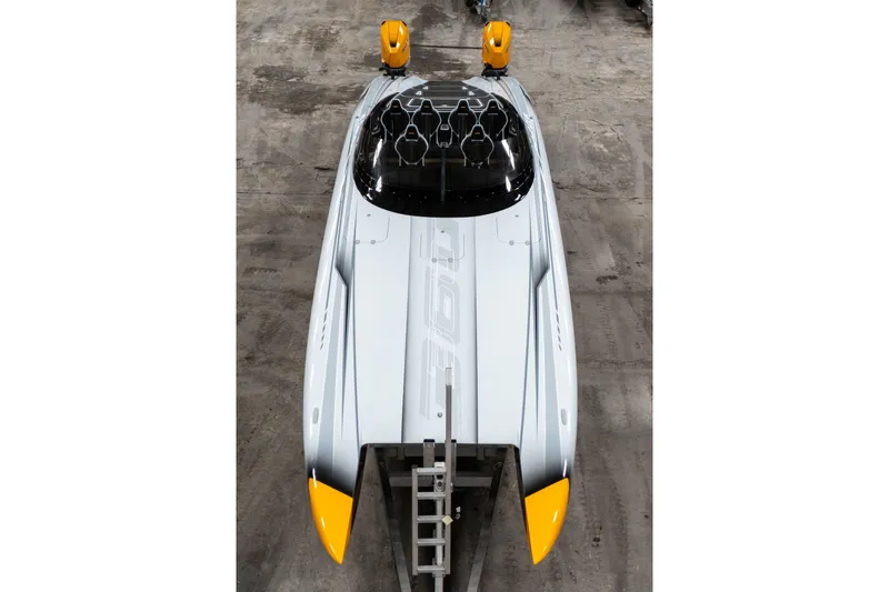 Slide: The Image of 2026 Doug Wright 36 powerboat with sleek design and yellow accents, viewed from above. - 10