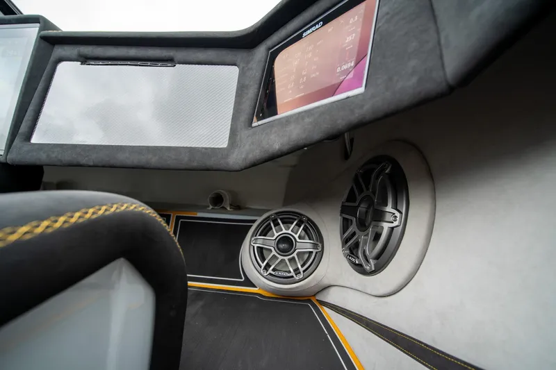 Slide: The Image of Interior of 2026 Doug Wright 36 boat with speakers and dashboard display. - 12