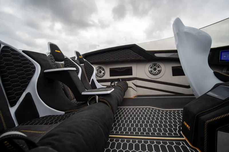 Slide: The Image of Interior of a 2026 Doug Wright 36 boat with modern seating and sleek design. - 13