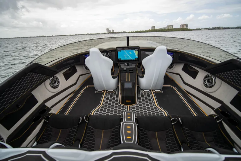 Slide: The Image of Interior of 2026 Doug Wright 36 boat with modern dashboard and sleek seating design. - 15