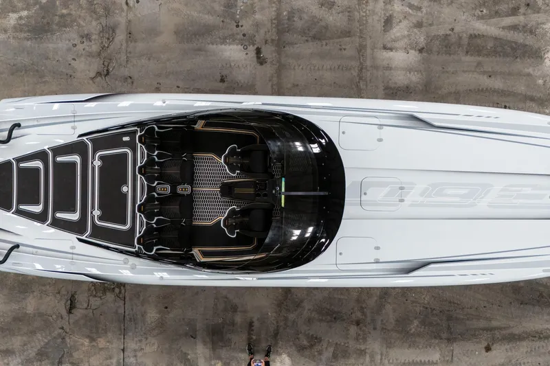 Slide: The Image of Overhead view of a sleek 2026 Doug Wright 36 powerboat on a concrete surface. - 4