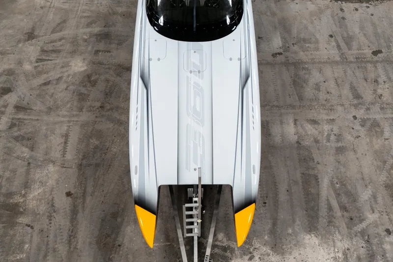 Slide: The Image of Top view of a 2026 Doug Wright 36 boat with sleek design and yellow accents. - 8