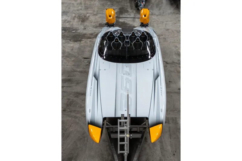 Slide: The Image of Top view of a 2026 Doug Wright 36 powerboat with sleek design and yellow accents. - 9