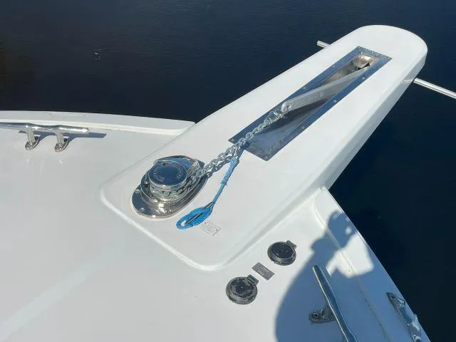 Slide: The Image of Bow of 1999 Viking 50 Convertible yacht with anchor chain and winch. - 14
