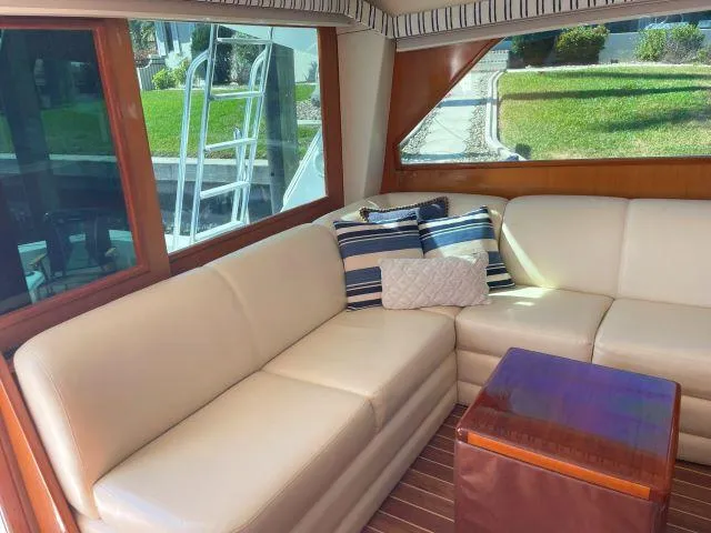 Slide: The Image of Luxurious interior of 1999 Viking 50 Convertible yacht with cream leather seating. - 15