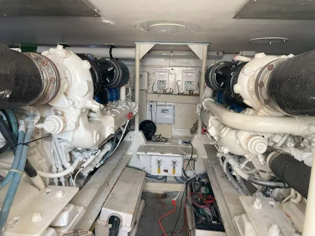 Slide: The Image of Engine room of 1999 Viking 50 Convertible yacht, showcasing dual engines and mechanical components. - 45