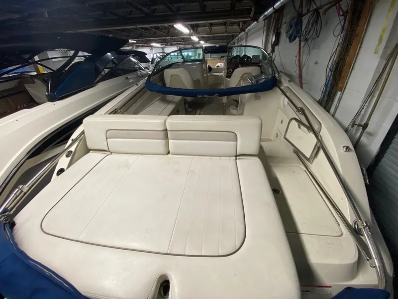 Slide: The Image of Interior view of a 2010 Sea Ray 280 Sundeck boat in storage. - 11