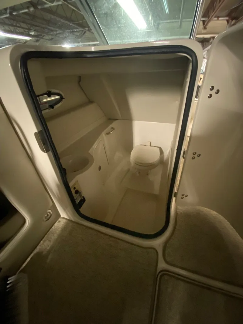 Slide: The Image of Interior of a 2010 Sea Ray 280 Sundeck with toilet. - 12