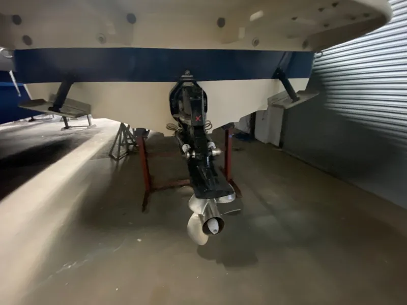 Slide: The Image of Rear view of a 2010 Sea Ray 280 Sundeck boat in storage. - 2