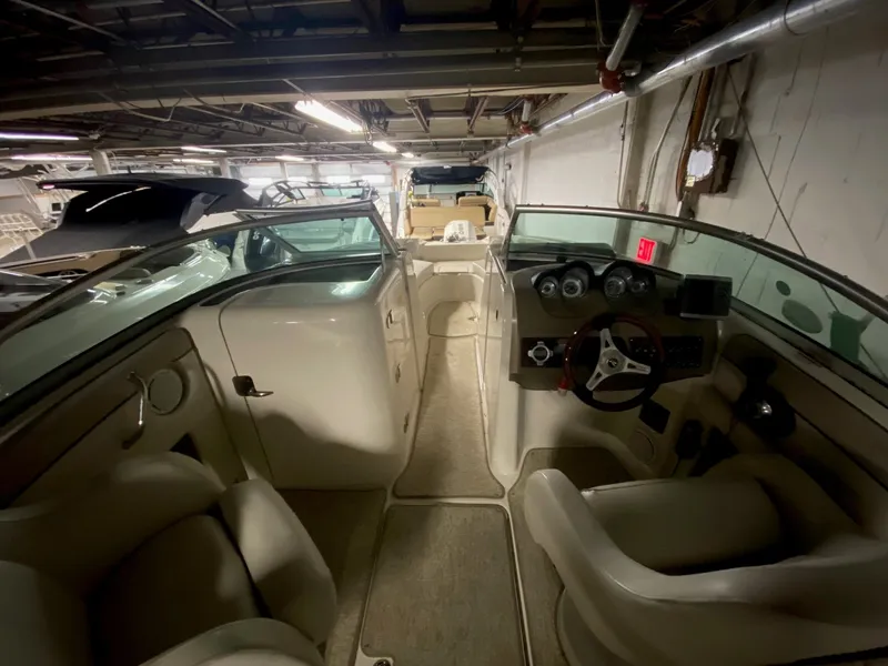 Slide: The Image of Interior view of a 2010 Sea Ray 280 Sundeck boat in storage. - 3
