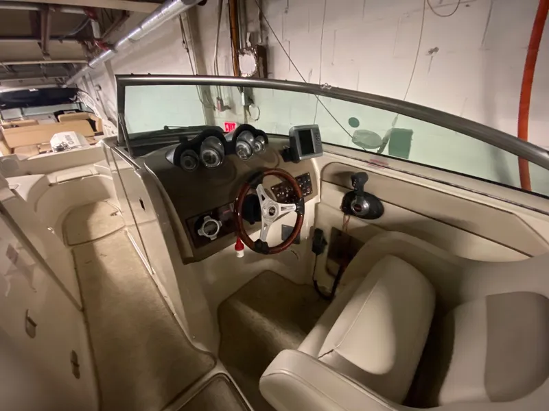 Slide: The Image of Interior of a 2010 Sea Ray 280 Sundeck boat with helm console. - 5