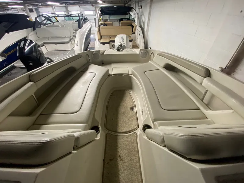 Slide: The Image of Interior view of a 2010 Sea Ray 280 Sundeck boat in storage. - 8