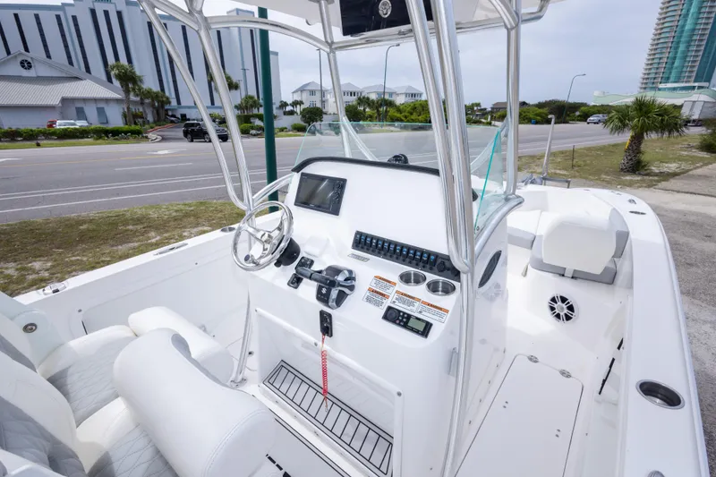 Slide: The Image of 2022 Twin Vee 240 GFX CC boat interior with modern console and seating. - 19