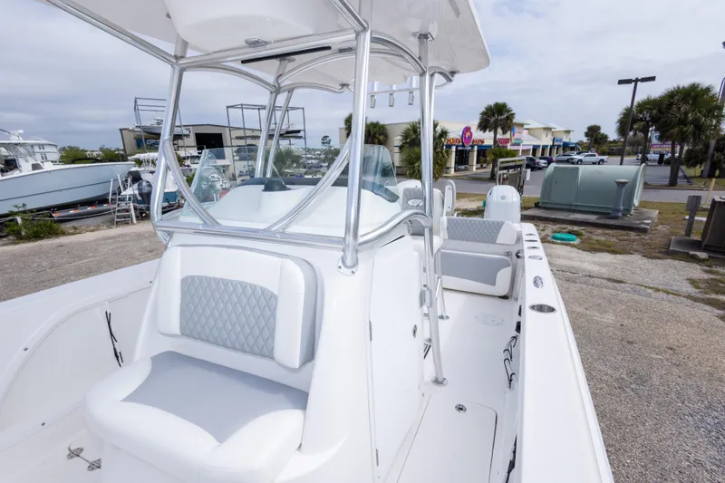 Slide: The Image of 2022 Twin Vee 240 GFX CC boat with sleek white seating and modern design. - 29