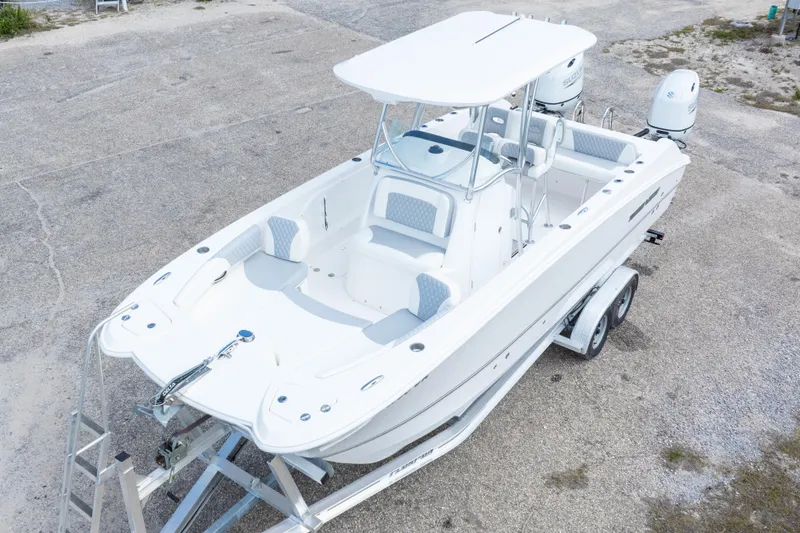 Slide: The Image of 2022 Twin Vee 240 GFX CC boat on trailer, aerial view, white exterior. - 42