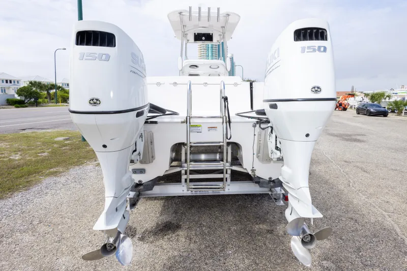 Slide: The Image of 2022 Twin Vee 240 GFX CC boat with dual Suzuki 150 outboard engines. - 6