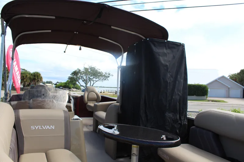 Slide: The Image of 2026 Sylvan Mirage Fish 820 Party Fish pontoon boat interior with seating and table. - 7