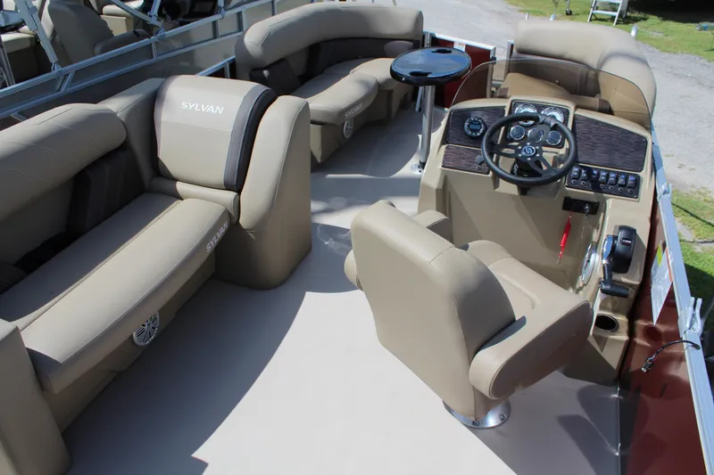 Slide: The Image of 2026 Sylvan Mirage Fish 820 Party Fish boat interior with plush seating and modern helm. - 8
