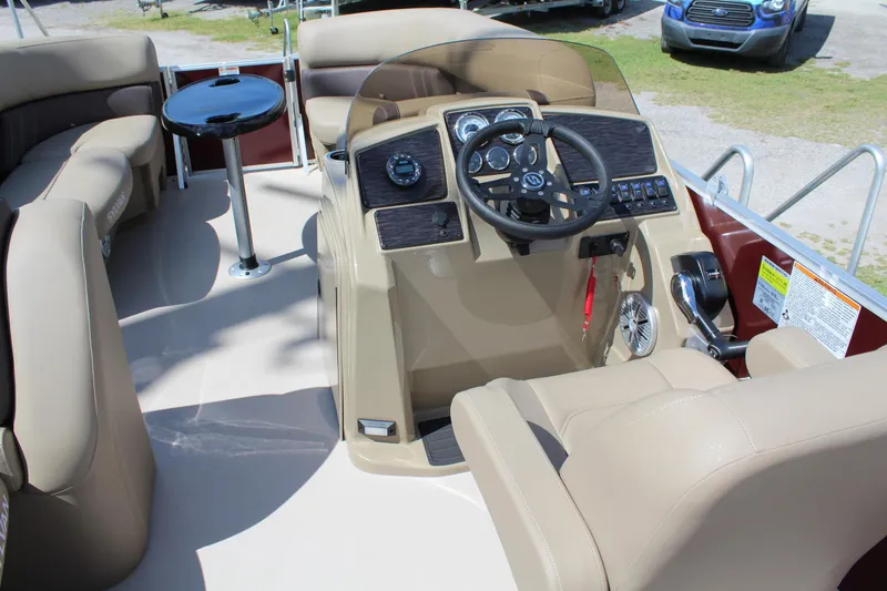 Slide: The Image of 2026 Sylvan Mirage Fish 820 Party Fish boat interior with steering console and seating. - 9