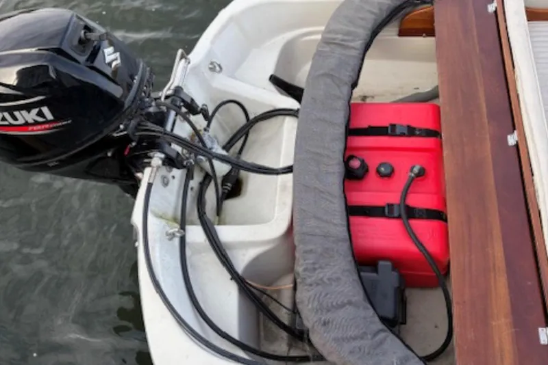 Slide: The Image of Outboard motor and fuel tank on a 1988 Boston Whaler 130 Super Sport boat. - 3