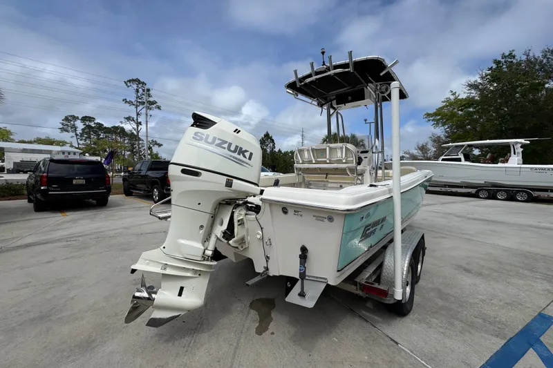 Slide: The Image of 2019 Carolina Skiff 21 Ultra Elite boat with Suzuki outboard motor on trailer. - 11