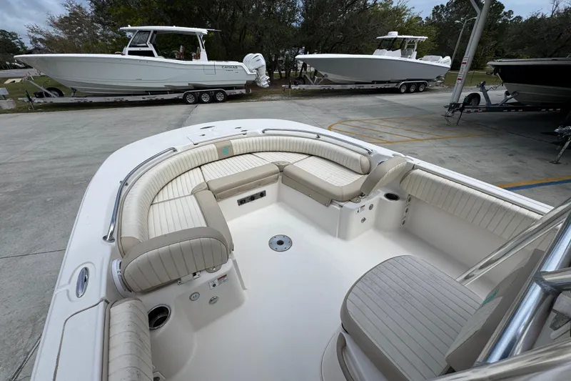 Slide: The Image of 2019 Carolina Skiff 21 Ultra Elite boat with spacious seating and sleek design. - 18