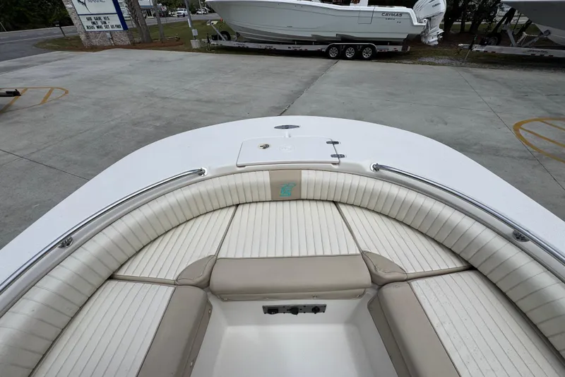 Slide: The Image of 2019 Carolina Skiff 21 Ultra Elite boat with cushioned seating and storage. - 19