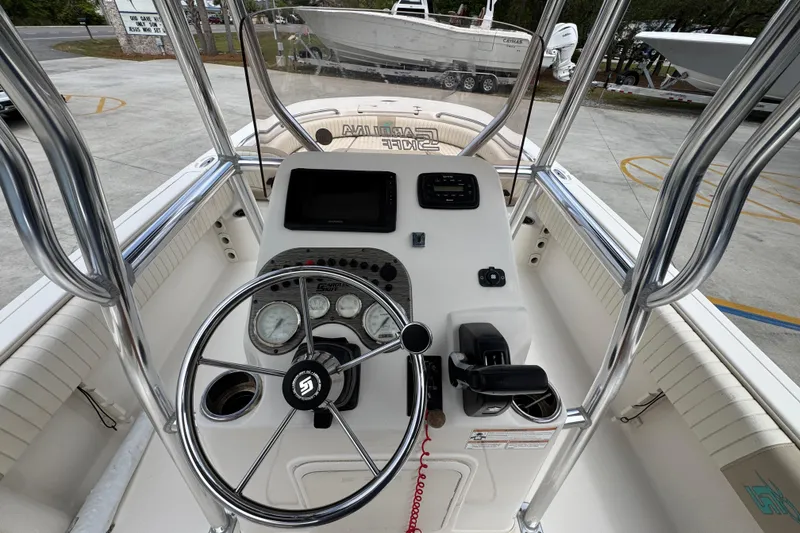 Slide: The Image of 2019 Carolina Skiff 21 Ultra Elite boat console with steering wheel and controls. - 30