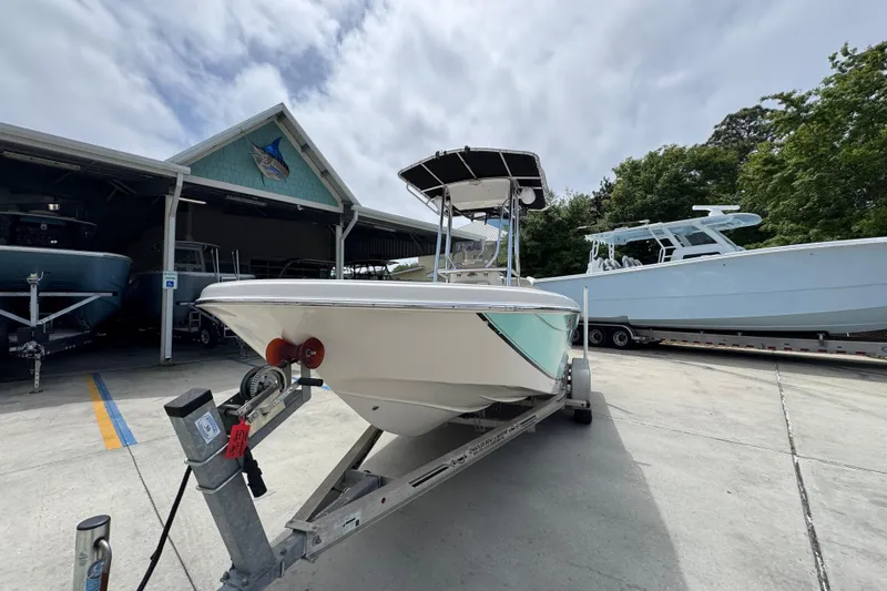 Slide: The Image of 2019 Carolina Skiff 21 Ultra Elite boat on trailer at marina. - 4