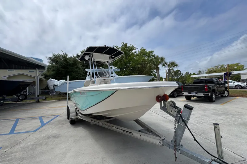 Slide: The Image of 2019 Carolina Skiff 21 Ultra Elite boat on trailer in parking lot. - 6