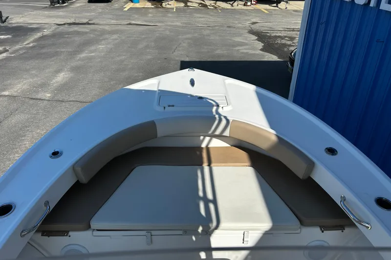 Slide: The Image of 2019 Parker 21 Special Edition boat with cushioned seating and sleek design. - 14