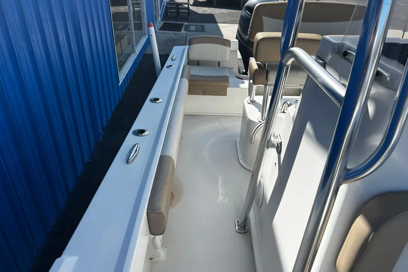 Slide: The Image of 2019 Parker 21 Special Edition boat interior with seating and railing. - 18
