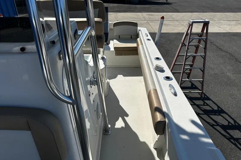 Slide: The Image of 2019 Parker 21 Special Edition boat interior with seating and ladder in sunlight. - 19