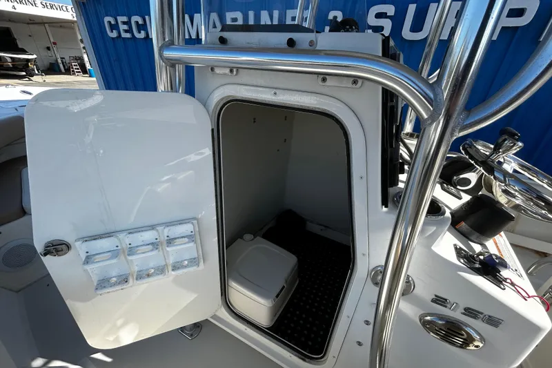 Slide: The Image of Open storage compartment on a 2019 Parker 21 Special Edition boat, showcasing interior space. - 20