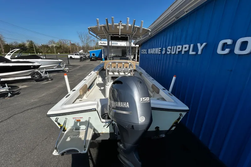 Slide: The Image of 2019 Parker 21 Special Edition boat with Yamaha 150 engine at marine supply store. - 4
