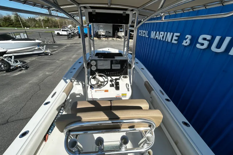 Slide: The Image of 2019 Parker 21 Special Edition boat interior at Cecil Marine, featuring helm and seating. - 5