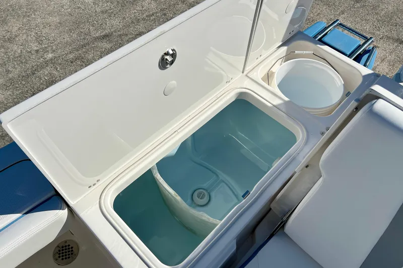 Slide: The Image of Livewell and storage compartments on 2026 Robalo 246 Cayman boat. - 11