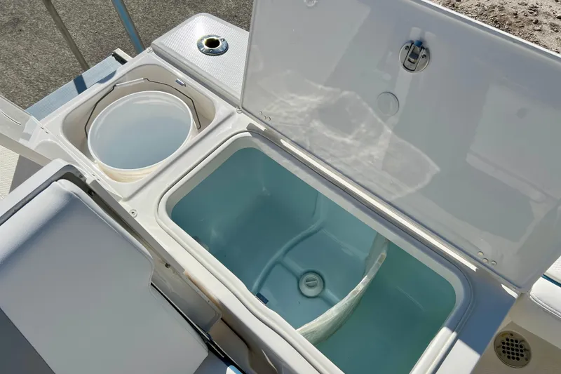 Slide: The Image of Livewell and storage compartments on 2026 Robalo 246 Cayman boat. - 12