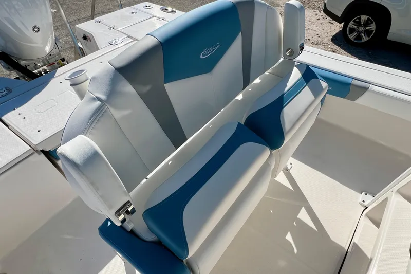 Slide: The Image of 2026 Robalo 246 Cayman boat interior with blue and white seating. - 16
