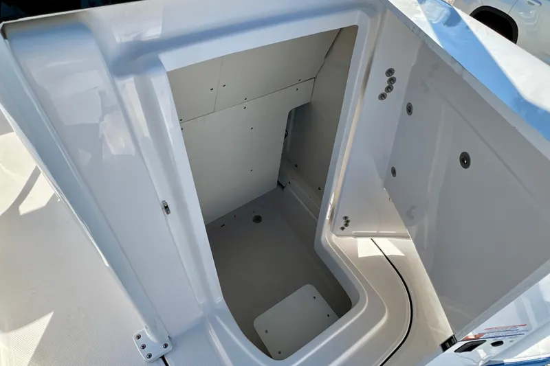 Slide: The Image of 2026 Robalo 246 Cayman boat storage compartment, open and spacious design. - 25