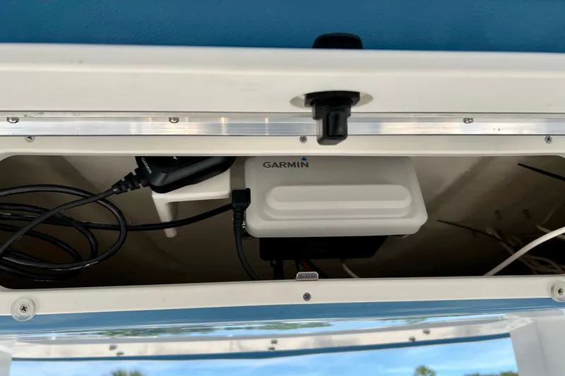 Slide: The Image of Garmin device installed on 2026 Robalo 246 Cayman boat, showcasing wiring and setup. - 30