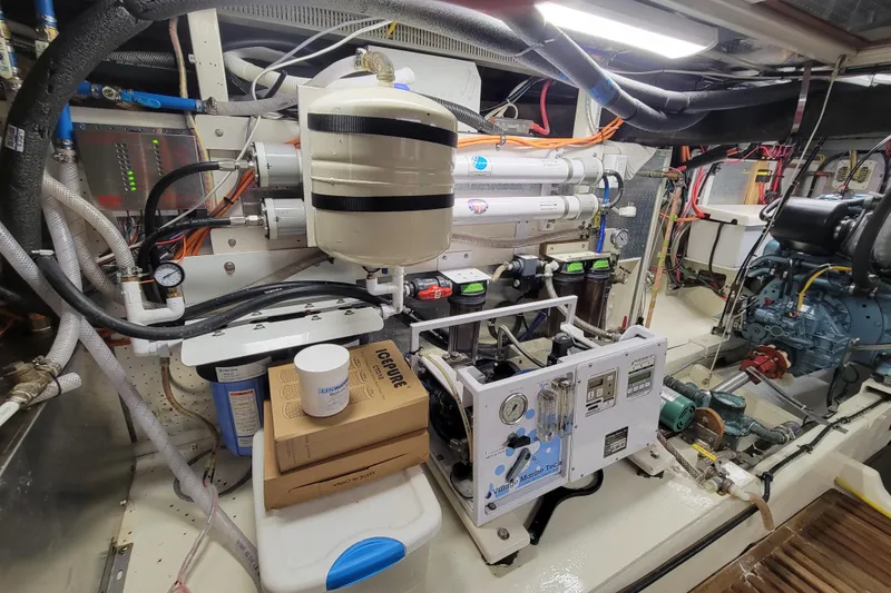 Slide: The Image of Engine room of a 2001 DeFever Pilothouse yacht with water filtration system. - 15