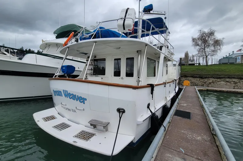 Slide: The Image of 2001 DeFever Pilothouse yacht docked, featuring "Dream Weaver" name, Anacortes, WA. - 5