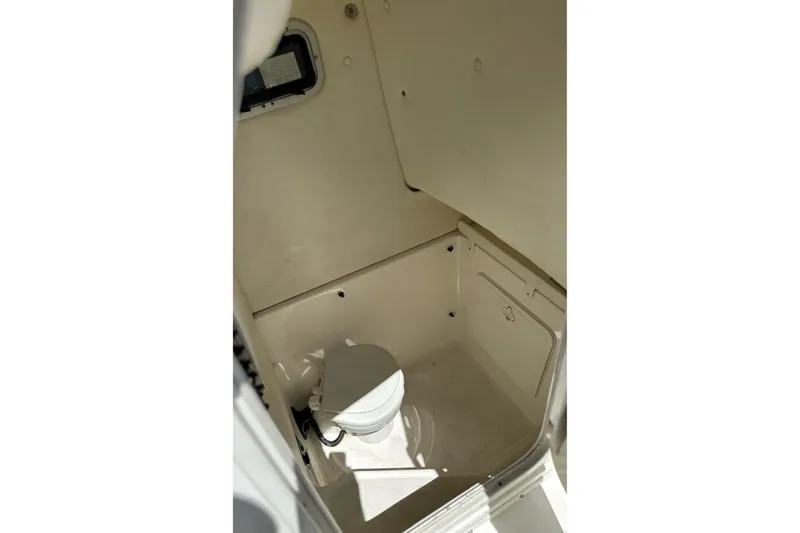 Slide: The Image of Interior view of a 2007 Century 2600 Center Console boat's compact bathroom. - 10