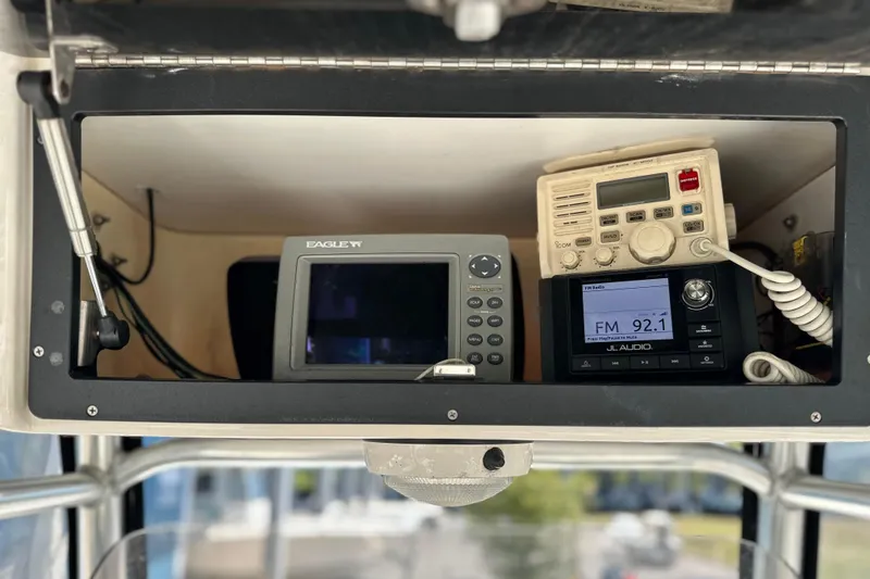 Slide: The Image of Electronics panel on a 2007 Century 2600 Center Console boat with radio and navigation equipment. - 13